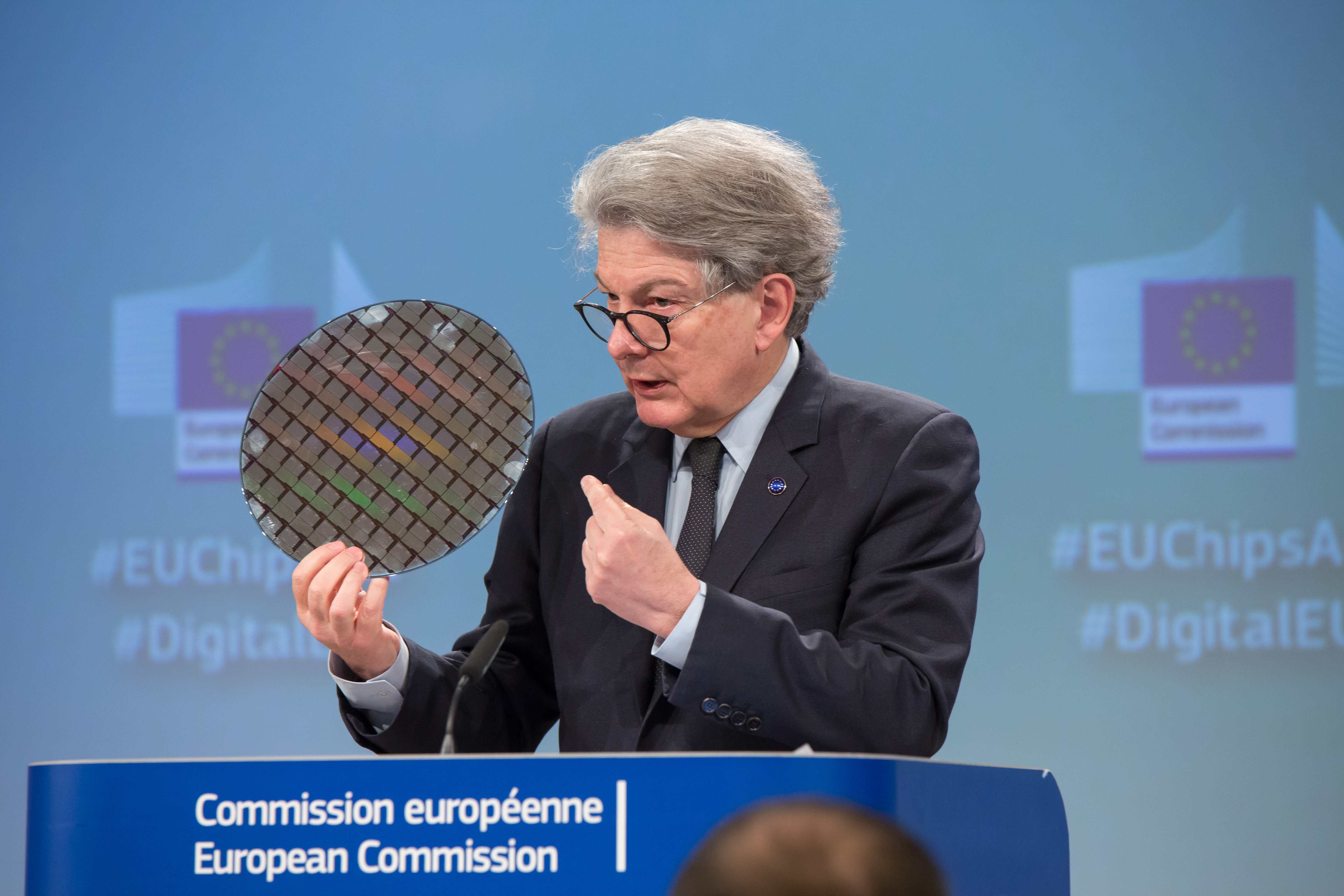 EU Commssioner Thierry Breton holding wafer at the launch of the EU Chips Act